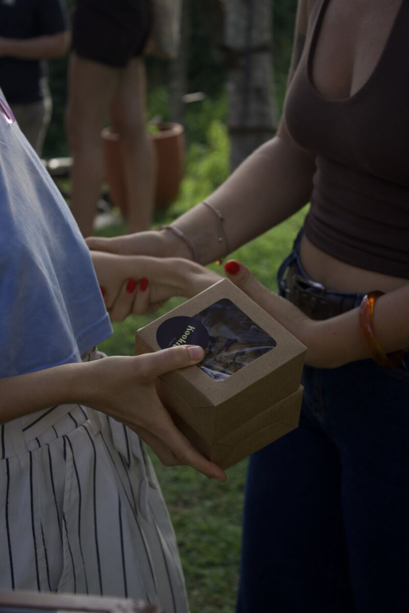 Handing over a box of Kookie cookies